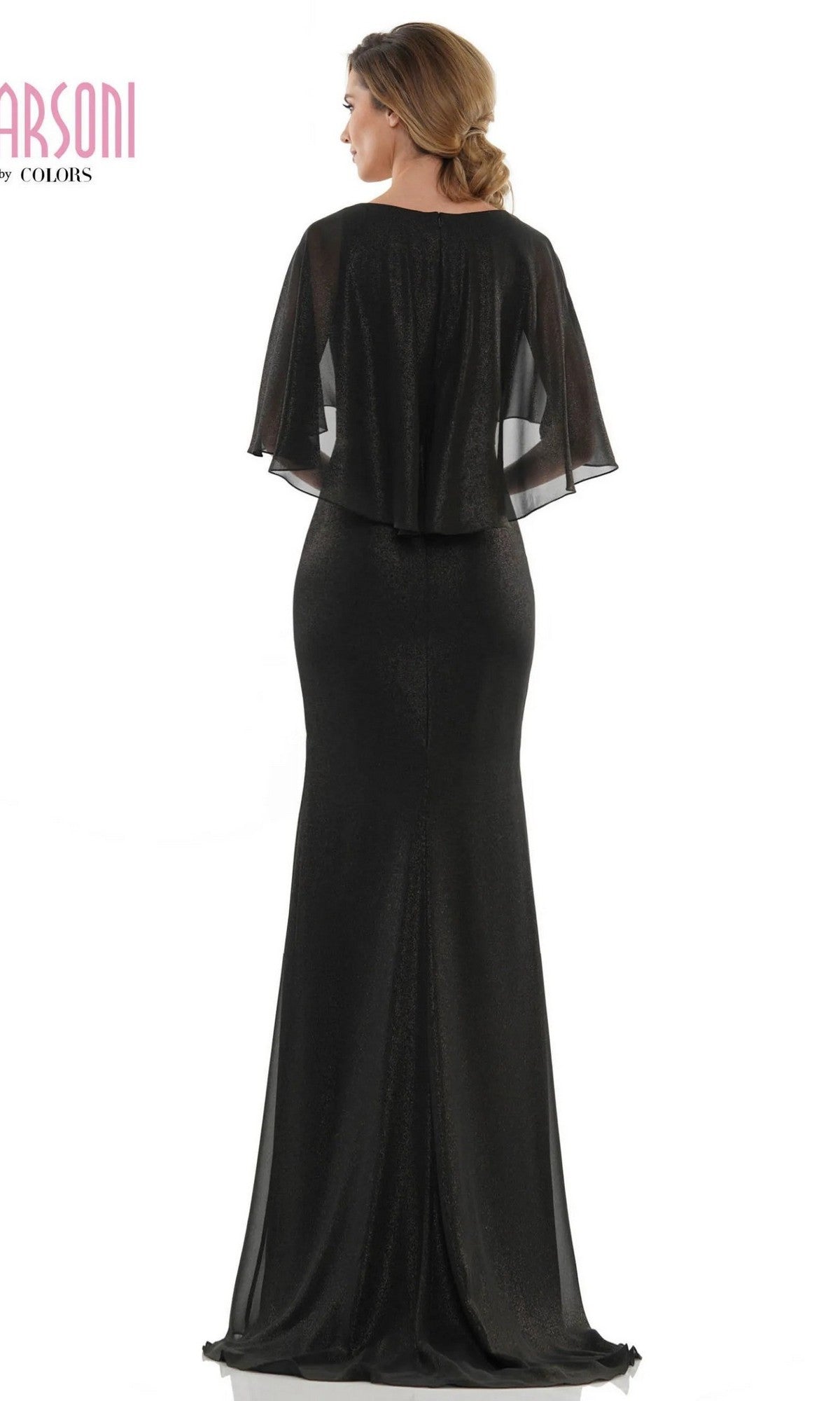 A woman stands with her back to the camera in the Marsoni MV1130 long formal dress, featuring a fitted sheath silhouette and a sheer cape-style overlay.